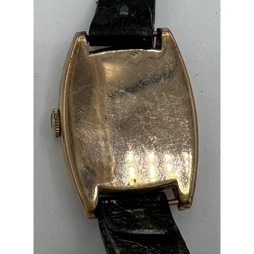 975 - A nine carat gold cased Rolex wristwatch on leather strap. 2.5cms square.