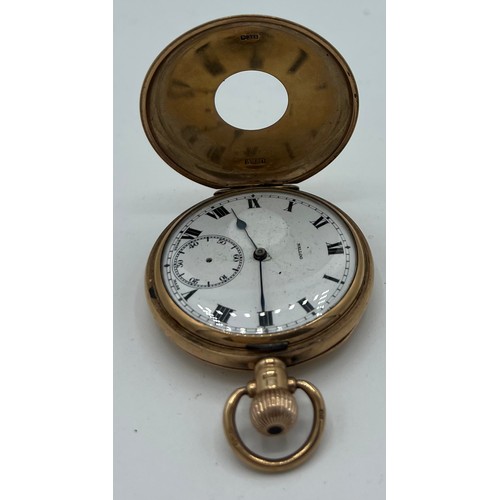 976 - Nine carat gold half hunter pocket watch. 5cm diameter. Total weight 99gm.