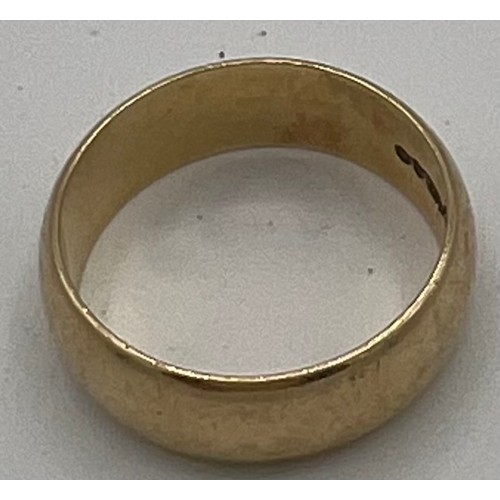 547 - A nine carat gold wedding band. 5.3gm. Size Q.