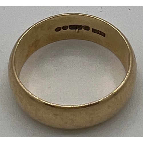 547 - A nine carat gold wedding band. 5.3gm. Size Q.