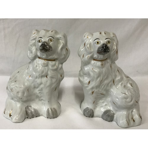 319 - A pair of Staffordshire dogs 14cm h.