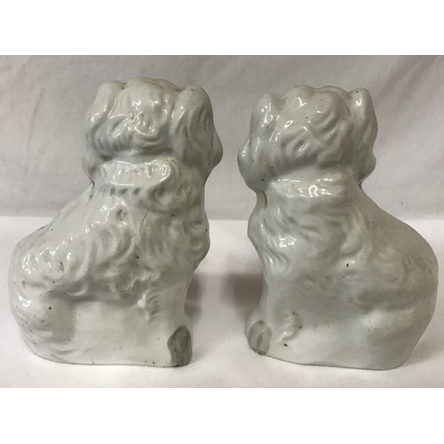 319 - A pair of Staffordshire dogs 14cm h.