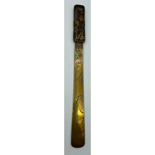 947 - A Japanese copper and brass paper knife. Length 30cm