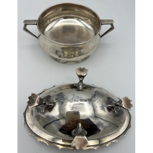 722 - Silver to include a twin handled bowl, Birmingham 1932, makers marks rubbed and a dish raised on fou... 