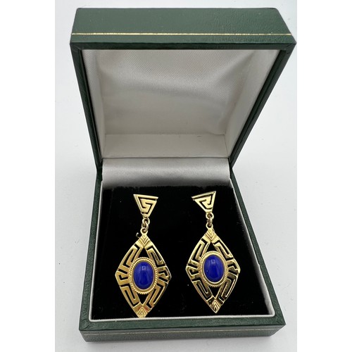 553 - Yellow metal drop earrings set with Lapis Lazuli. Tests as 14 carat. 4cm drop.