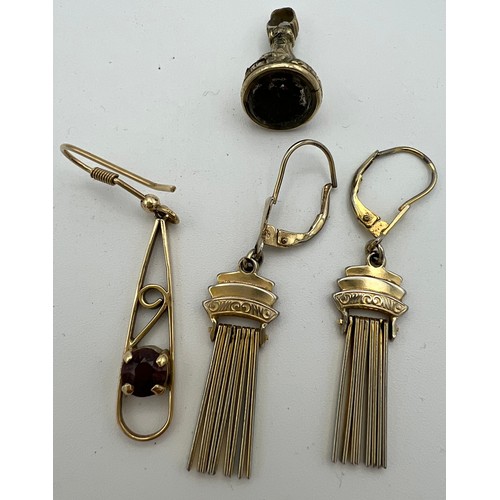 554 - Yellow metal to include a pair of earrings, single earring and a watch fob. Tests as 9 carat gold. T... 