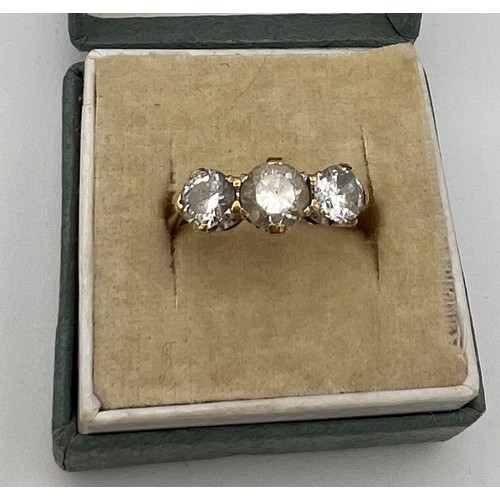 555 - A 9 carat gold ring set with clear stones. Probably white zircon. Size K. Weight 2.2gm.