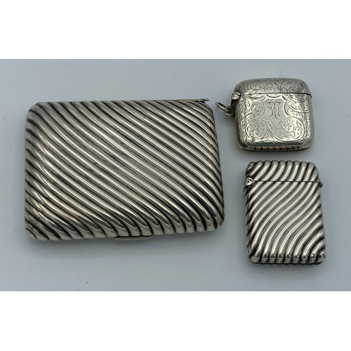 724 - A silver cigarette case London 1893 maker Henry Charles Freeman together with 2 vesta cases, one cas... 