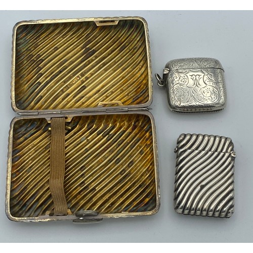 724 - A silver cigarette case London 1893 maker Henry Charles Freeman together with 2 vesta cases, one cas... 