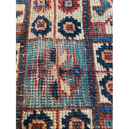 1209 - Oriental wool rug measuring approx 272 x 164cm.