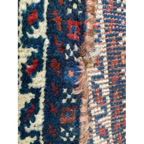 1209 - Oriental wool rug measuring approx 272 x 164cm.