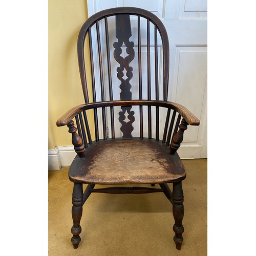 75 - A 19thC ash and elm Windsor chair measuring height to back 97cm, height to seat approx. 36cm.