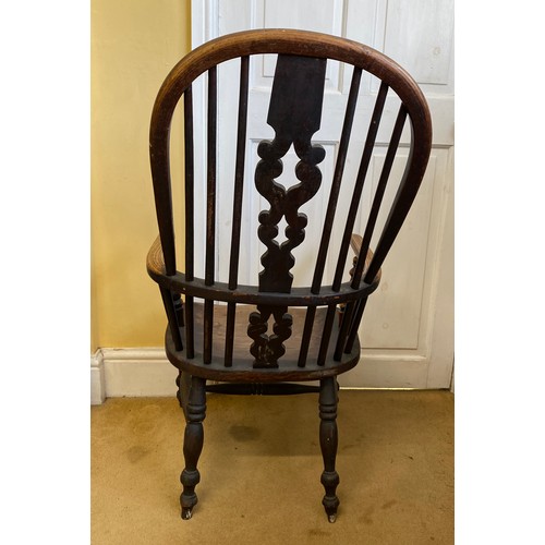 75 - A 19thC ash and elm Windsor chair measuring height to back 97cm, height to seat approx. 36cm.