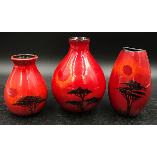 329 - Poole pottery to include three small vases with the 'African Sky' pattern, tallest 13cm h.