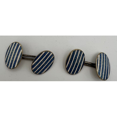 565 - Nine carat gold and enamel cufflinks with white metal joiners. Total weight 5.7gm.