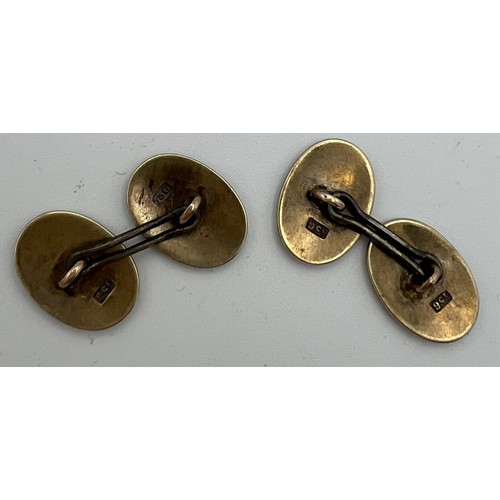 565 - Nine carat gold and enamel cufflinks with white metal joiners. Total weight 5.7gm.