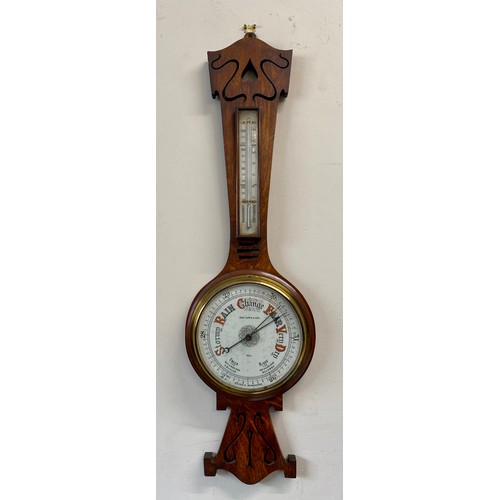 1190 - An Art Nouveau oak aneroid barometer, Robert Curtis & Son, Hull. 91cm h.