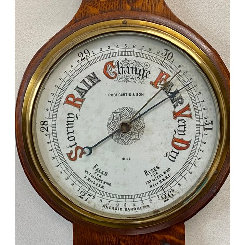 1190 - An Art Nouveau oak aneroid barometer, Robert Curtis & Son, Hull. 91cm h.