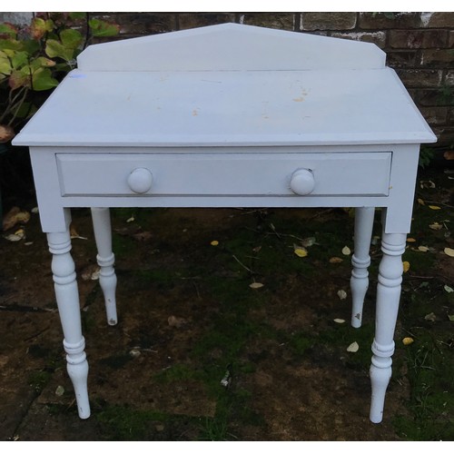 76 - A white painted pine side table with single drawer. 83h x 78w x 46cm d.