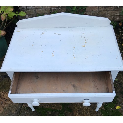 76 - A white painted pine side table with single drawer. 83h x 78w x 46cm d.