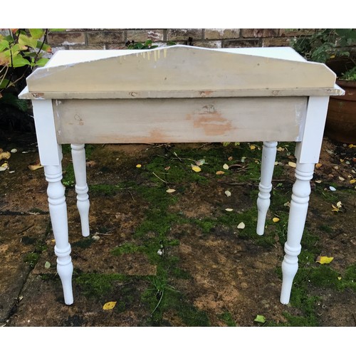 76 - A white painted pine side table with single drawer. 83h x 78w x 46cm d.