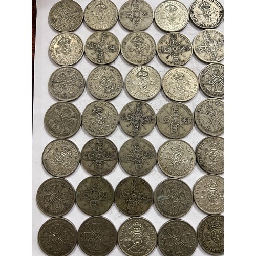 642 - A collection of pre 1946 One Florin and Two Shilling coins. 784.3gm.