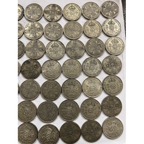 642 - A collection of pre 1946 One Florin and Two Shilling coins. 784.3gm.