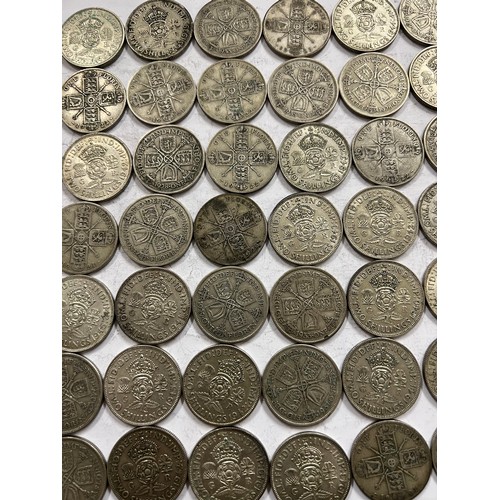 642 - A collection of pre 1946 One Florin and Two Shilling coins. 784.3gm.