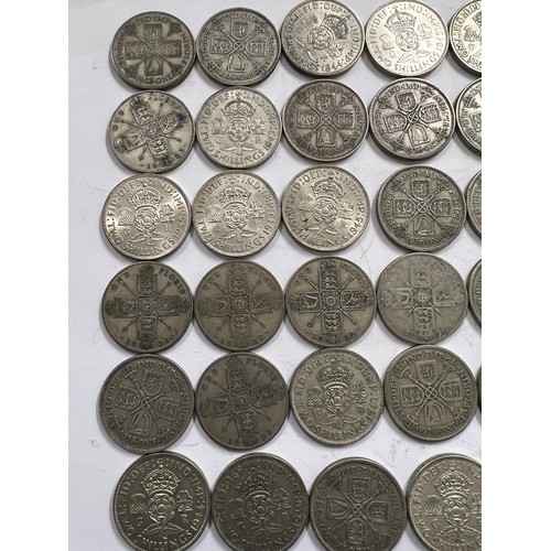 643 - A collection of pre 1946 One Florin and Two Shilling coins. 537.5gm.