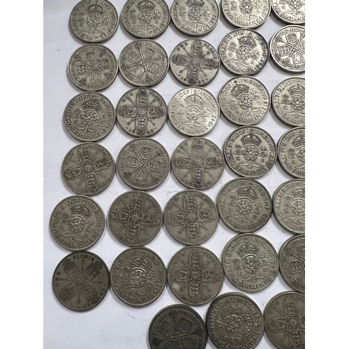 644 - A collection of pre 1946 One Florin and Two Shilling coins. One 1918 Florin, 671.4gm.