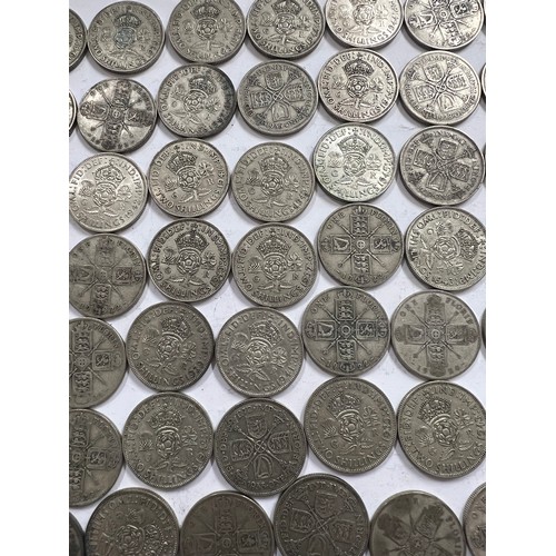 644 - A collection of pre 1946 One Florin and Two Shilling coins. One 1918 Florin, 671.4gm.