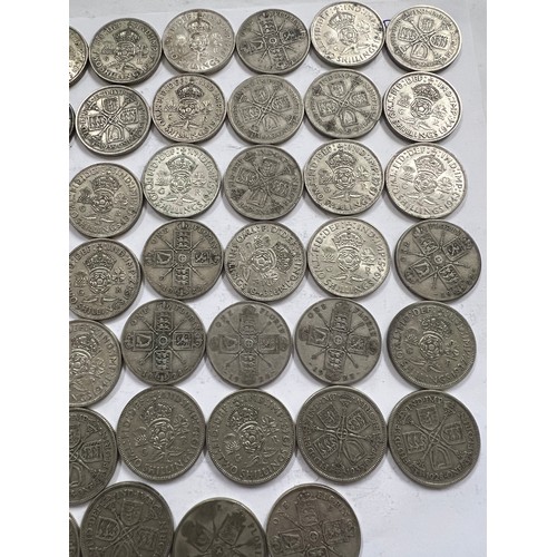 644 - A collection of pre 1946 One Florin and Two Shilling coins. One 1918 Florin, 671.4gm.