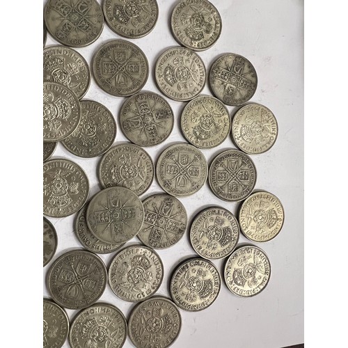 650 - A collection of pre 1946 One Florin and Two Shilling coins. 649.3gm.