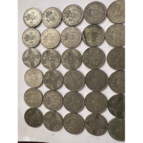 651 - A collection of pre 1946 One Florin and Two Shilling coins. 559.2gm.