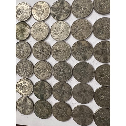 651 - A collection of pre 1946 One Florin and Two Shilling coins. 559.2gm.