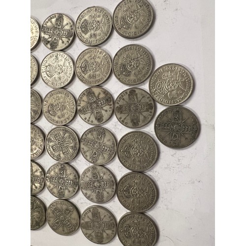 651 - A collection of pre 1946 One Florin and Two Shilling coins. 559.2gm.