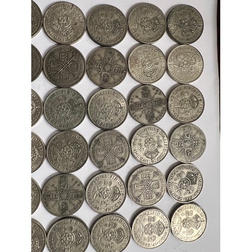 653 - A collection of pre 1946 One Florin and Two Shilling coins. 561.8gm.