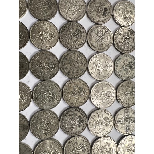 653 - A collection of pre 1946 One Florin and Two Shilling coins. 561.8gm.