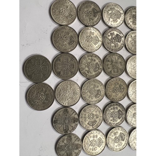 653 - A collection of pre 1946 One Florin and Two Shilling coins. 561.8gm.