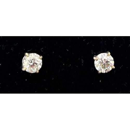 560 - A pair of diamond stud earrings. Total weight 0.82 carat, S1 G/H set in 18 carat white gold.