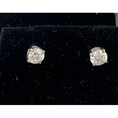 560 - A pair of diamond stud earrings. Total weight 0.82 carat, S1 G/H set in 18 carat white gold.