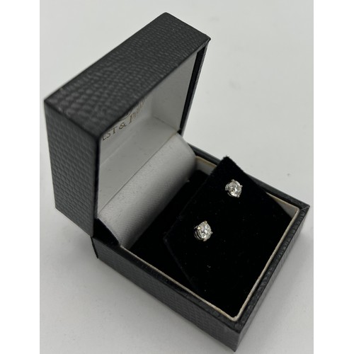 560 - A pair of diamond stud earrings. Total weight 0.82 carat, S1 G/H set in 18 carat white gold.