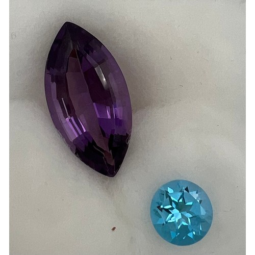 561 - Loose cut and polished amethyst approximate size 3cm x1.3cm and a topaz.