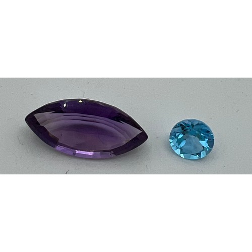 561 - Loose cut and polished amethyst approximate size 3cm x1.3cm and a topaz.