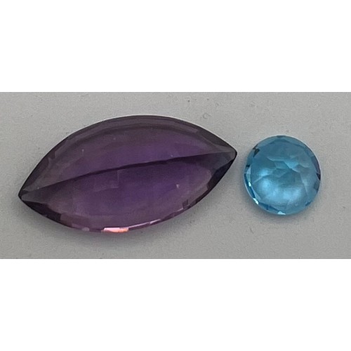 561 - Loose cut and polished amethyst approximate size 3cm x1.3cm and a topaz.