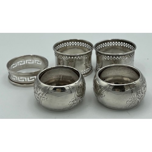 723 - Five hallmarked silver napkin rings, various dates and makers. Total weight 90gm.