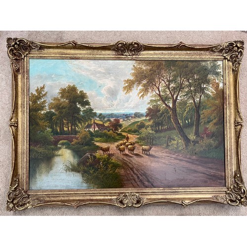 1572 - Oil on canvas landscape, sheep on a country lane in gilt frame. 49 x 74cm.