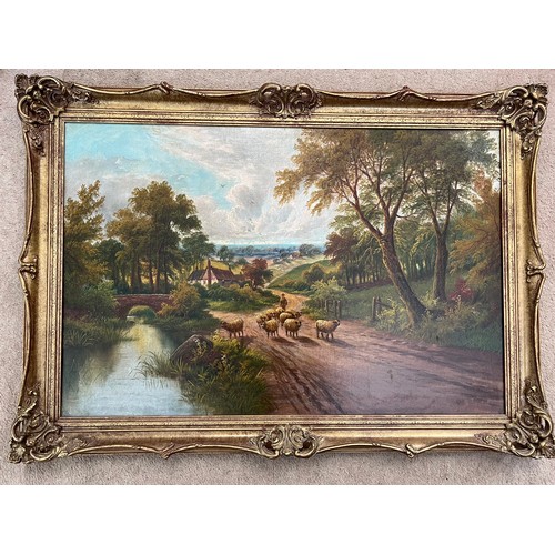 1572 - Oil on canvas landscape, sheep on a country lane in gilt frame. 49 x 74cm.