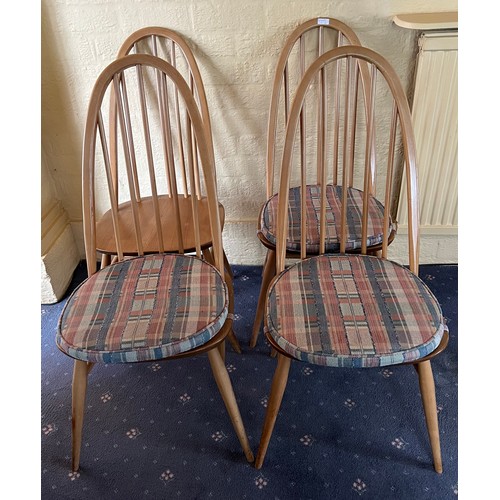 92 - A set of four stick back Ercol dining chairs.