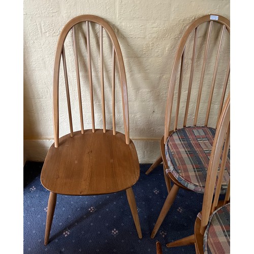 92 - A set of four stick back Ercol dining chairs.